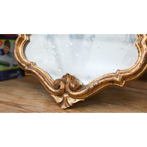 181 - An Italian rococo style wall mirror in ornate gilt frame, 62 cm high