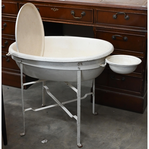 183 - A Victorian painted papier-maché baby bath on metal stand, 56 cm high to/w a set of baby-scales (2)