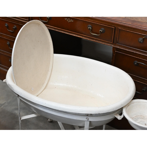 183 - A Victorian painted papier-maché baby bath on metal stand, 56 cm high to/w a set of baby-scales (2)