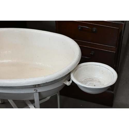 183 - A Victorian painted papier-maché baby bath on metal stand, 56 cm high to/w a set of baby-scales (2)