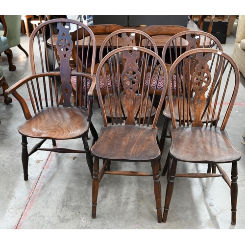 185 - A set of six ash and elm wheelback dining chairs (2 carvers and 4 standard)