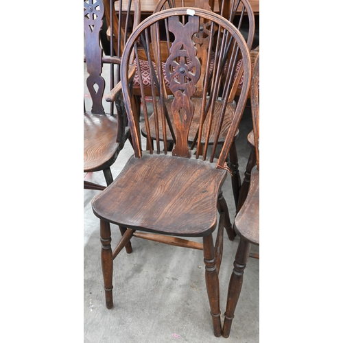 185 - A set of six ash and elm wheelback dining chairs (2 carvers and 4 standard)