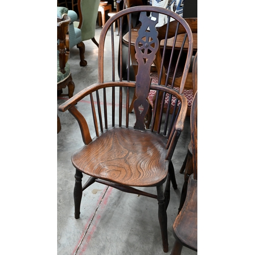 185 - A set of six ash and elm wheelback dining chairs (2 carvers and 4 standard)