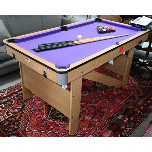 187 - A BCE Rolling lay-flat 5ft pool table with purple baise c/w balls, triangle, four cues, chalk and as... 