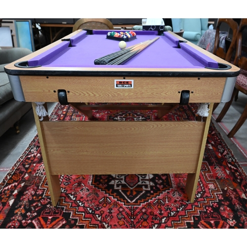 187 - A BCE Rolling lay-flat 5ft pool table with purple baise c/w balls, triangle, four cues, chalk and as... 