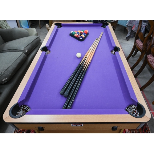 187 - A BCE Rolling lay-flat 5ft pool table with purple baise c/w balls, triangle, four cues, chalk and as... 