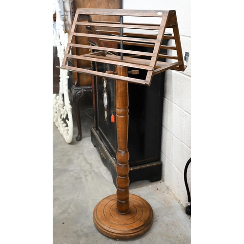 196 - An early 20th century hardwood adjustable duet music stand on bobbin turned column and circular base