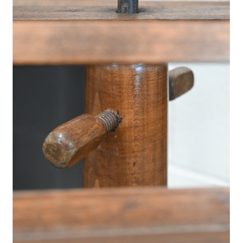 196 - An early 20th century hardwood adjustable duet music stand on bobbin turned column and circular base