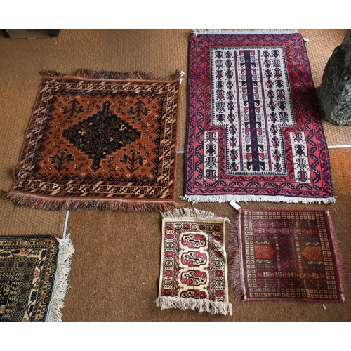 197 - A Persian Balouch prayer rug, cream ground with red borders 129 x 82 cm to/w machine made square rug... 