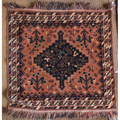 197 - A Persian Balouch prayer rug, cream ground with red borders 129 x 82 cm to/w machine made square rug... 