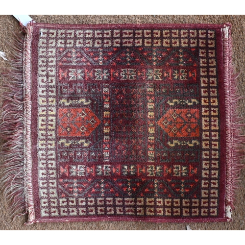 197 - A Persian Balouch prayer rug, cream ground with red borders 129 x 82 cm to/w machine made square rug... 