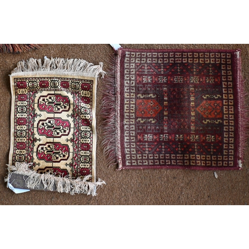 197 - A Persian Balouch prayer rug, cream ground with red borders 129 x 82 cm to/w machine made square rug... 