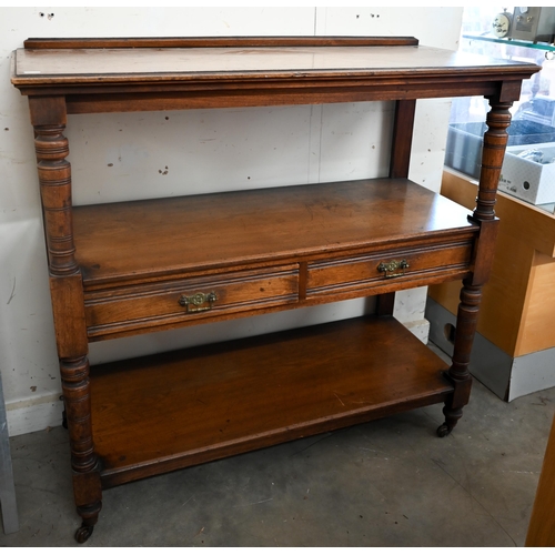 198 - An Edwardian mahogany three-tier buffet with two drawers and turned supports on casters, 104 x 46 x ... 