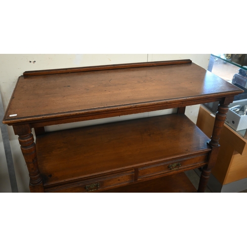 198 - An Edwardian mahogany three-tier buffet with two drawers and turned supports on casters, 104 x 46 x ... 