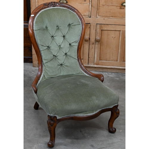 199 - A Victorian carved mahogany nursing chair with green dralon button back upholstery