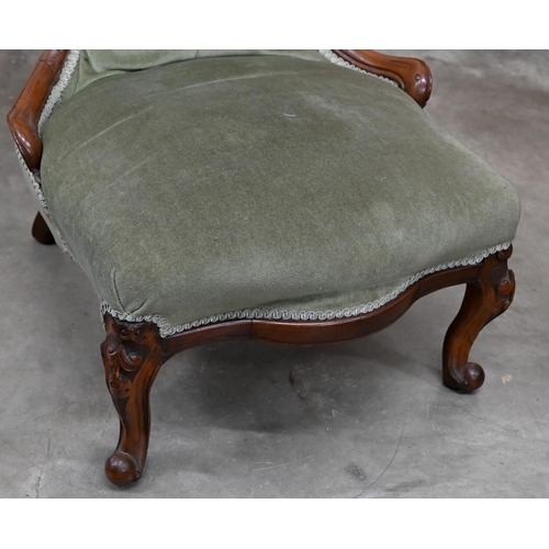 199 - A Victorian carved mahogany nursing chair with green dralon button back upholstery