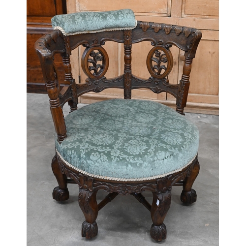 200 - A late 19th century Continental 'Burgermeister' chair, the carved oak frame with three floral rounde... 