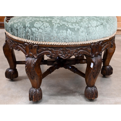 200 - A late 19th century Continental 'Burgermeister' chair, the carved oak frame with three floral rounde... 