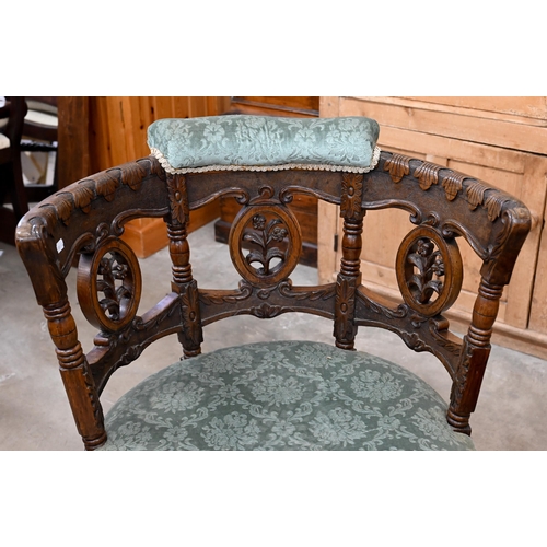 200 - A late 19th century Continental 'Burgermeister' chair, the carved oak frame with three floral rounde... 