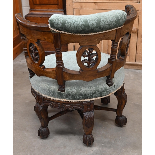 200 - A late 19th century Continental 'Burgermeister' chair, the carved oak frame with three floral rounde... 