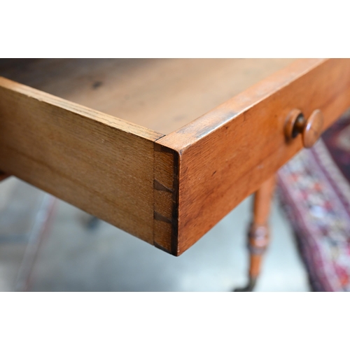 202 - A late Victorian satin birch writing table with hinged panel enclosing stationery compartments and s... 