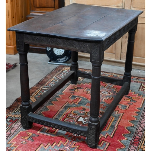 204 - An antique oak hall table with lunette carved frieze and turned supports united by stretchers, 100 x... 