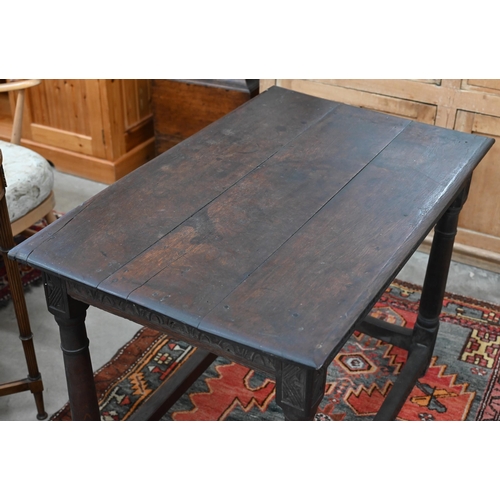 204 - An antique oak hall table with lunette carved frieze and turned supports united by stretchers, 100 x... 