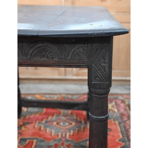 204 - An antique oak hall table with lunette carved frieze and turned supports united by stretchers, 100 x... 