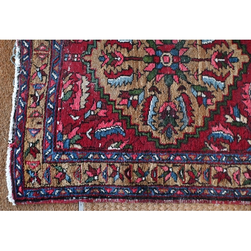 212 - A Persian Hamadan runner with five floral medallions on dark red ground, 333 x 89 cm to/w a Turkoman... 