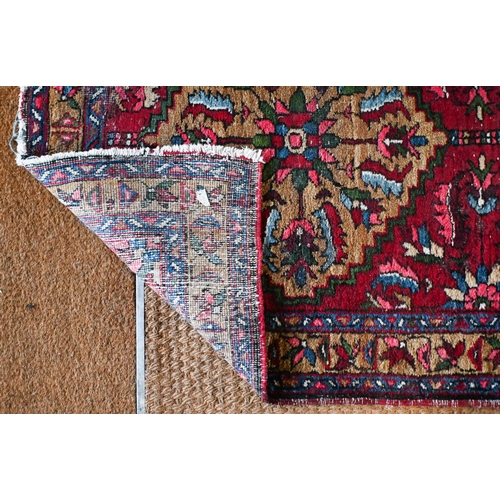 212 - A Persian Hamadan runner with five floral medallions on dark red ground, 333 x 89 cm to/w a Turkoman... 