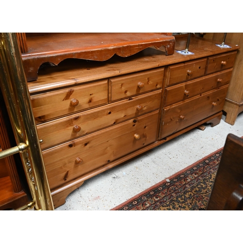 214 - A modern pine (possibly Ducal) sideboard with eight drawers, 166 x 46 x 74 cm