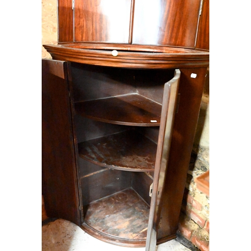 218 - An antique mahogany barrel front corner cabinet, 96 cm high