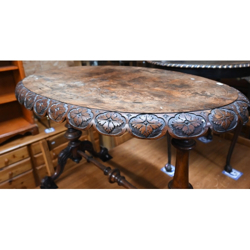 223 - A Victorian walnut foliate carved oval table, a/f, 102 x 64 x 70 cm high