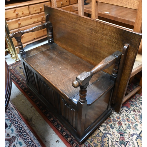 225 - Oak box seated and linen fold carved monks bench, 86 cm wide