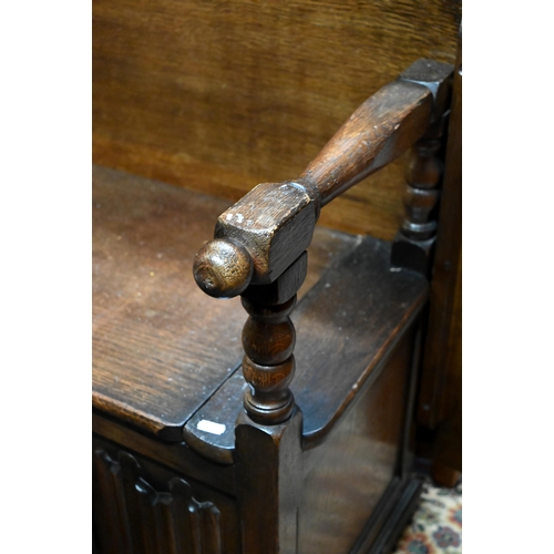 225 - Oak box seated and linen fold carved monks bench, 86 cm wide