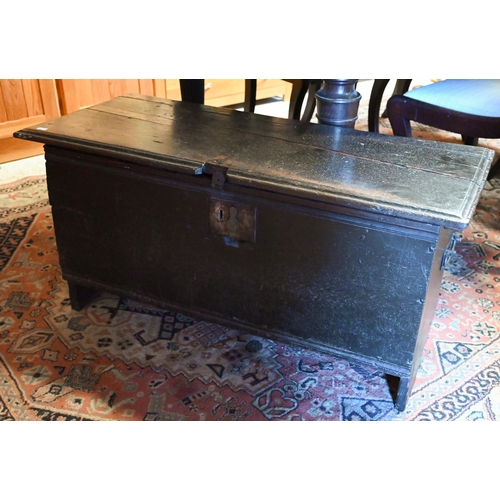 228 - A 17th century oak plank coffer of traditional construction with hinged top, interior candle box and... 