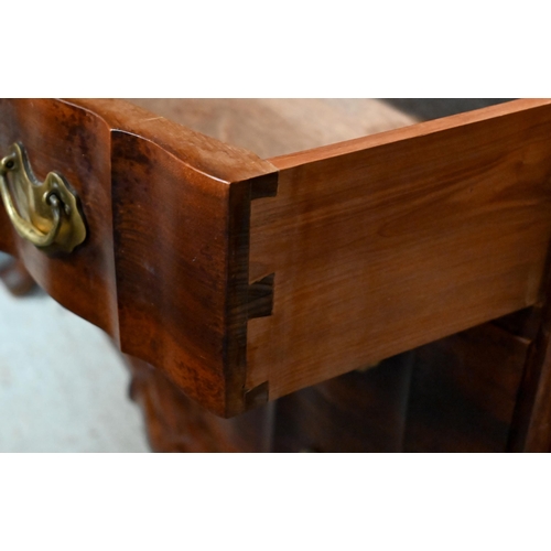 25 - A South African stinkwood dresser, the open rack over a base centred by four drawers, on short cabri... 