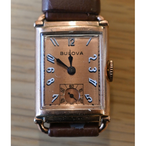 261 - A vintage gents Bulova gold plated manual wristwatch, circa 1940s, the bronzed dial with white Arabi... 