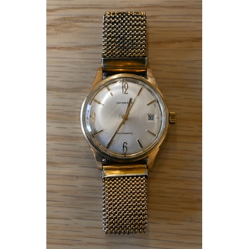 266 - A vintage Garrards 9ct gold gents manual wristwatch, the oyster dial with gilt Arabic and baton mark... 