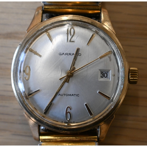 266 - A vintage Garrards 9ct gold gents manual wristwatch, the oyster dial with gilt Arabic and baton mark... 