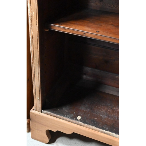 28 - An antique pine low open bookcase with adjustable shelves