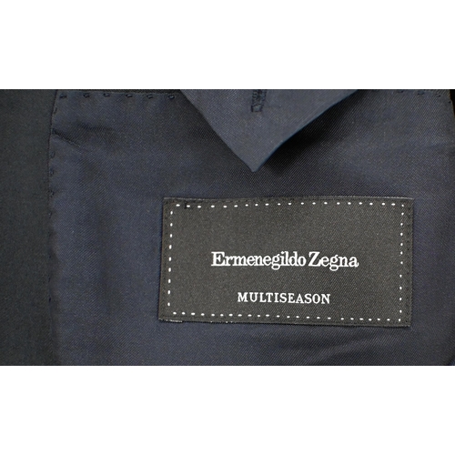 291 - AMENDED DESCRIPTION Ermenegildo Zegna - a multi-season navy wool suit to/w Elements raincoat and one... 