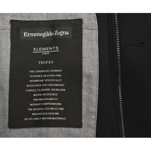 291 - AMENDED DESCRIPTION Ermenegildo Zegna - a multi-season navy wool suit to/w Elements raincoat and one... 