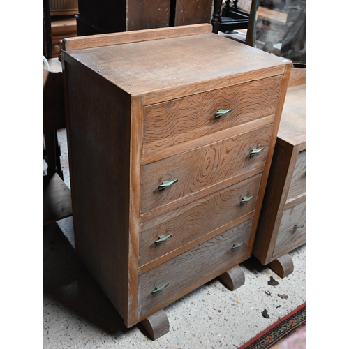 35 - A mid-century limed oak four drawer chest raised on sledges to/with a matching two drawer mirror bac... 