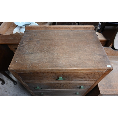 35 - A mid-century limed oak four drawer chest raised on sledges to/with a matching two drawer mirror bac... 