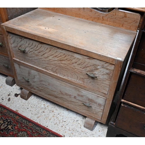 35 - A mid-century limed oak four drawer chest raised on sledges to/with a matching two drawer mirror bac... 