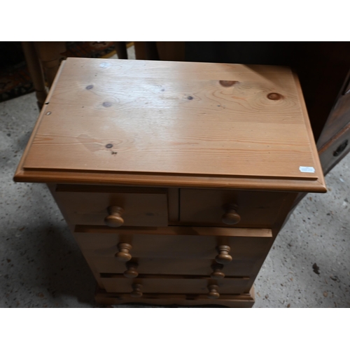 43 - A traditional golden oak circular occasional table on four turned legs united by cross stretcher to/... 