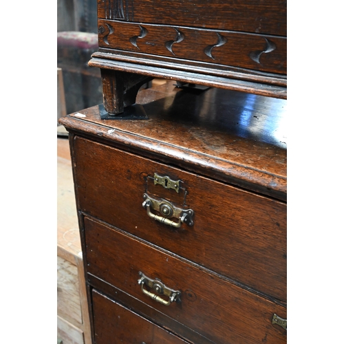 46 - An 18th century and later oak chest of  two short over three long graduated drawers, raised on shape... 