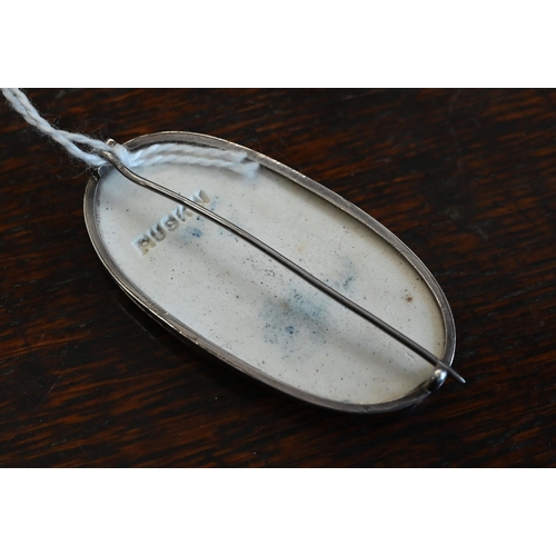 500 - A Ruskin blue-glazed ceramic oval brooch in unmarked white metal mount, stamped 'Ruskin' on back, 2.... 