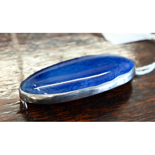 500 - A Ruskin blue-glazed ceramic oval brooch in unmarked white metal mount, stamped 'Ruskin' on back, 2.... 